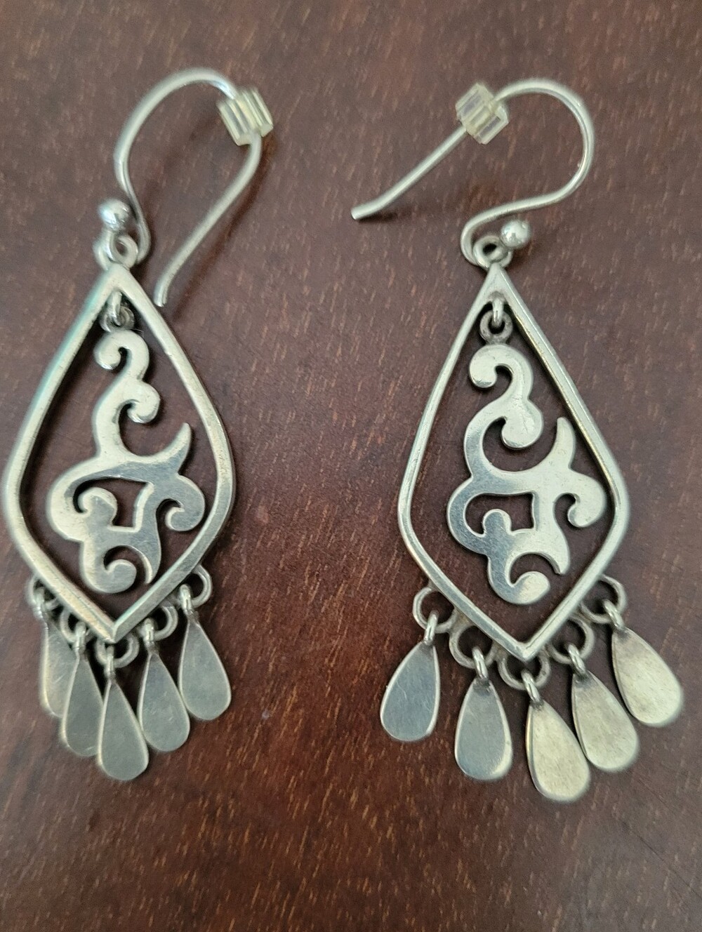 Silpada W1196 sterling silver dangling scroll drop earrings featuring an intrica